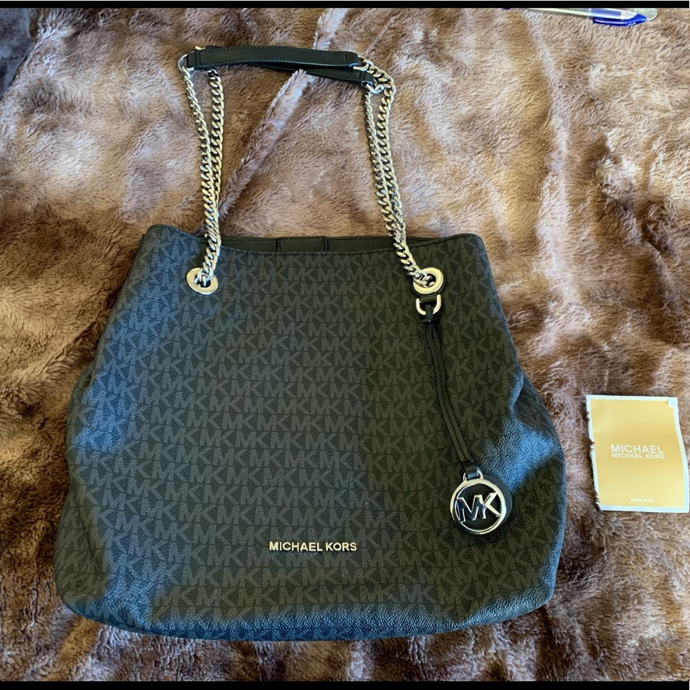Michael Kors medium purse. Black monogram with silver details.